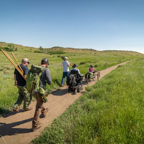 Hikers with trail building tools